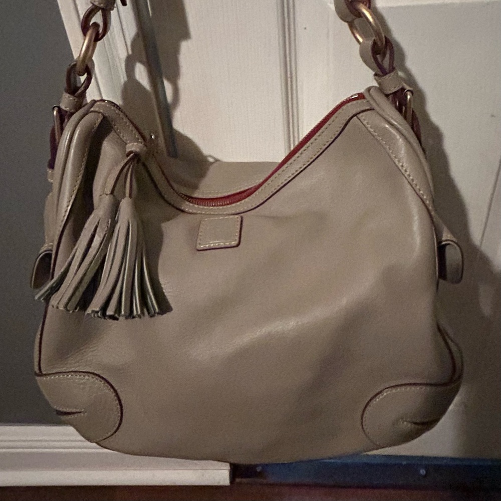 Slightly used tan Florentine leather Dooney and Bourke hobo.